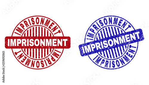 Grunge IMPRISONMENT round stamp seals isolated on a white background. Round seals with grunge texture in red and blue colors.