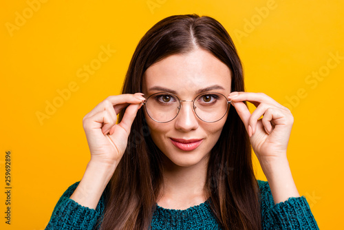 Fototapeta Naklejka Na Ścianę i Meble -  Close-up portrait of her she nice attractive lovely clever smart brainy nerd cheerful cheery straight-haired girl touching round glasses isolated over bright vivid shine yellow background