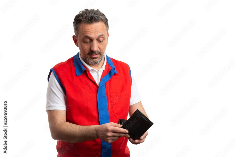 Supermarket employee looking inside wallet. Supermarket employee looking inside wallet.