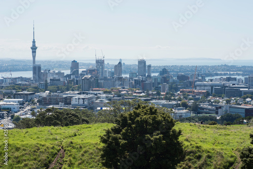 Elevated view of the centre of Auckland City from the summit of volcanic crater of Mount Eden, with the North Shore and Hauraki Gulf in the background.