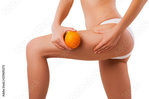 close-up perfect female body, model with an orange in hand. - image 