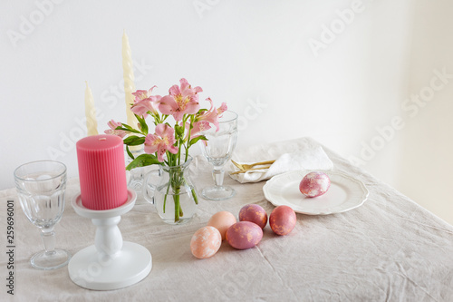 Festive Easter spring table setting with flowers