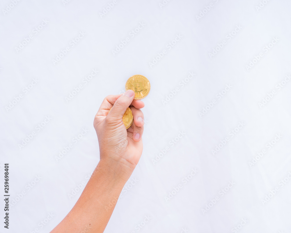 Cryptocurrency coin gold in hand on white background, Cryptocurrency coin gold in hand on white background,