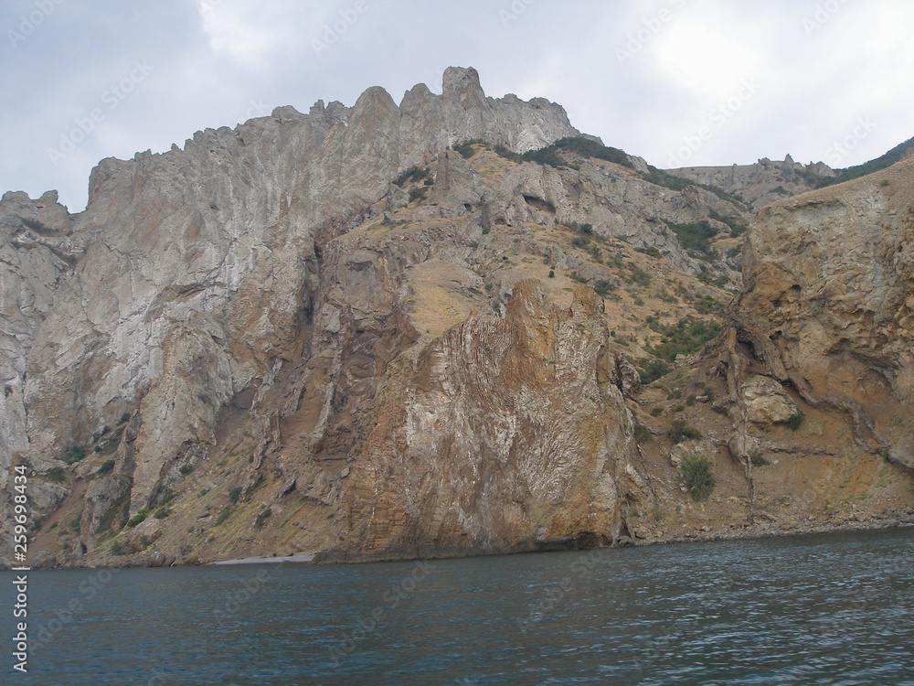 Rocks and the sea. Mountain Karadag. Volcanic massif. Black Sea. Crimea
