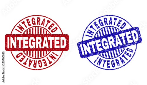 Grunge INTEGRATED round stamp seals isolated on a white background. Round seals with grunge texture in red and blue colors. Vector rubber imprint of INTEGRATED title inside circle form with stripes.