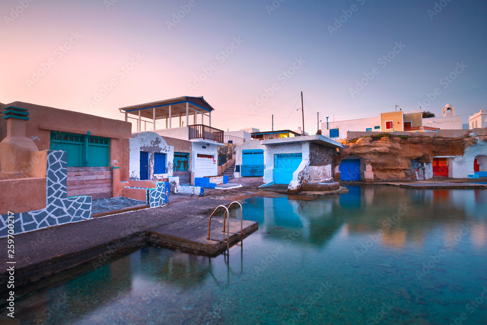 Boat houses in the harbour of Mandrakia village on the northern coast of Milos island.