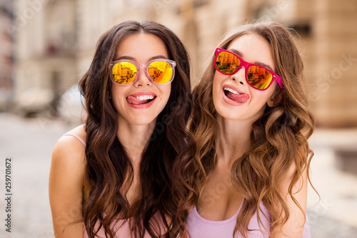 Close up photo magnificent sweet charming funny funky students ladies enjoy satisfied romance romantic travel trip long hair coquettes playful modern spring outfit bright specs town center outside photo