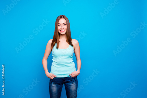 Portrait of cute pretty nice lady wearing modern denim outfit having stroll weekends holidays placing hands into pockets isolated on bright background © deagreez