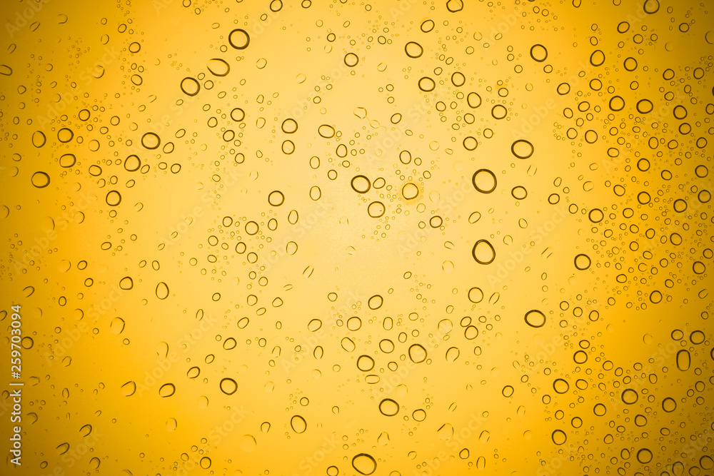 Water drops on yellow glass, Rain droplets on glass background. Water drops on yellow glass, Rain droplets on glass background.