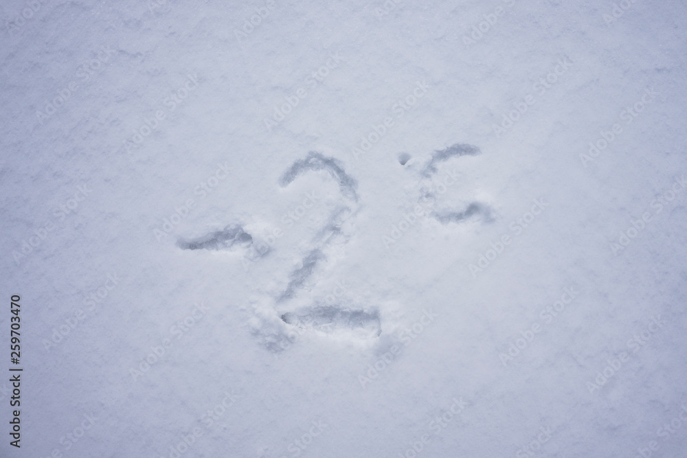 minus 2 degree celsius written into a snow background minus 2 degree celsius written into a snow background
