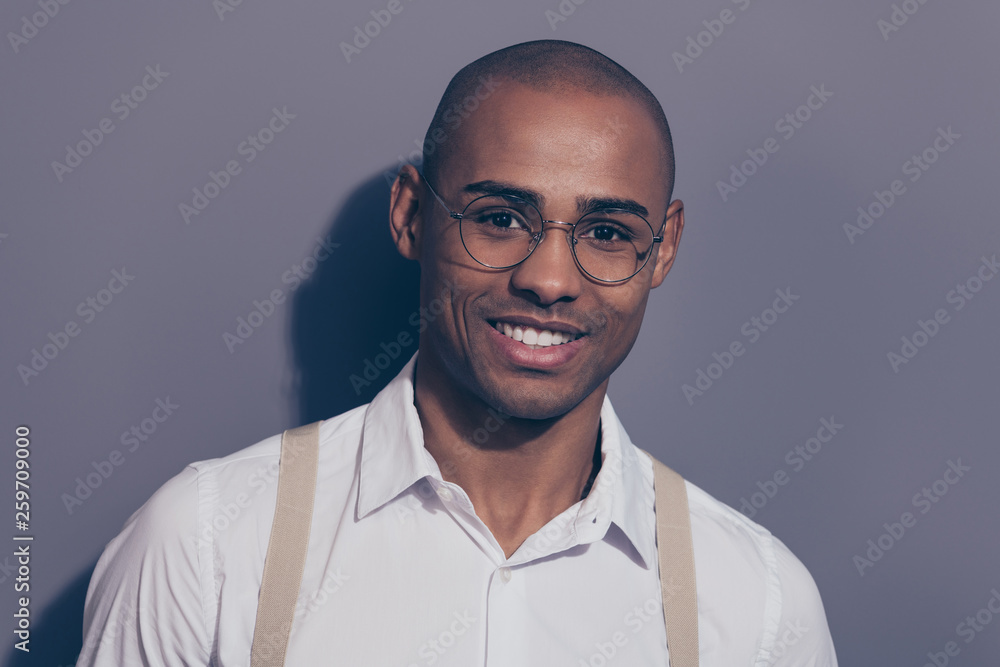 Fototapeta premium Close up photo beautiful amazing dark skin he him his macho toothy stunning manager employer collar financier boss chief shaved face wear specs pastel suspenders white shirt isolated grey background