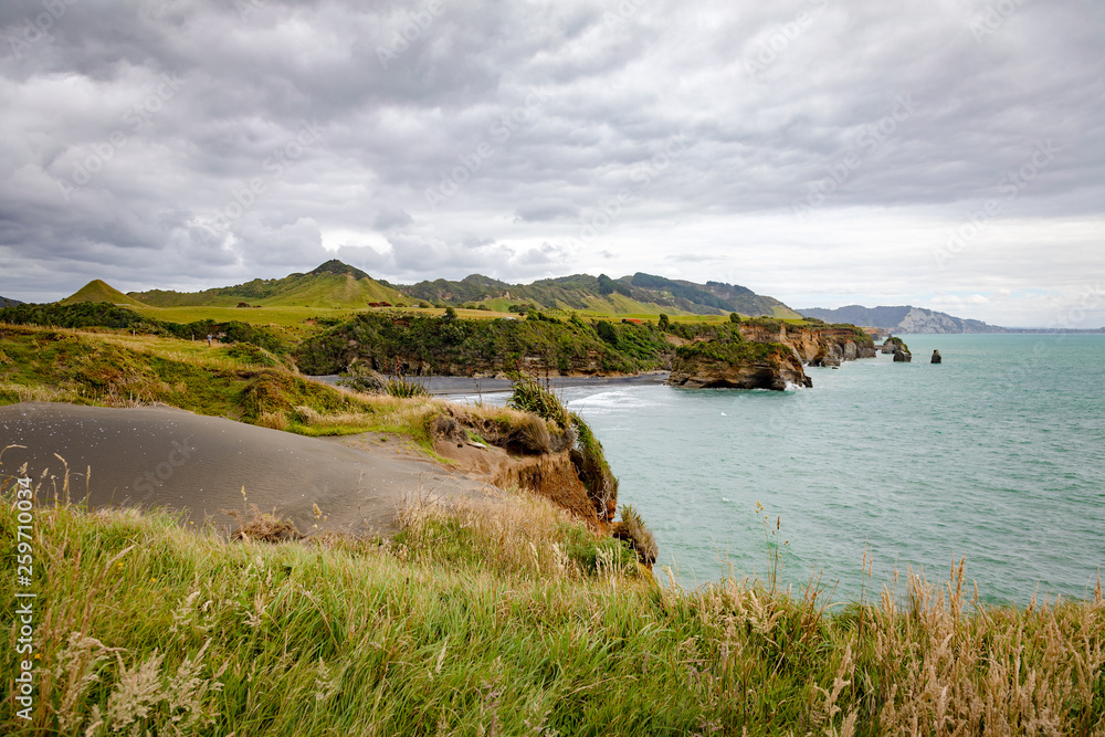 sea shore rocks and mount Taranaki, New Zealand sea shore rocks and mount Taranaki, New Zealand