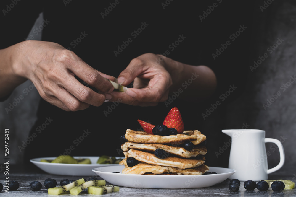 Woman preparing pancakes