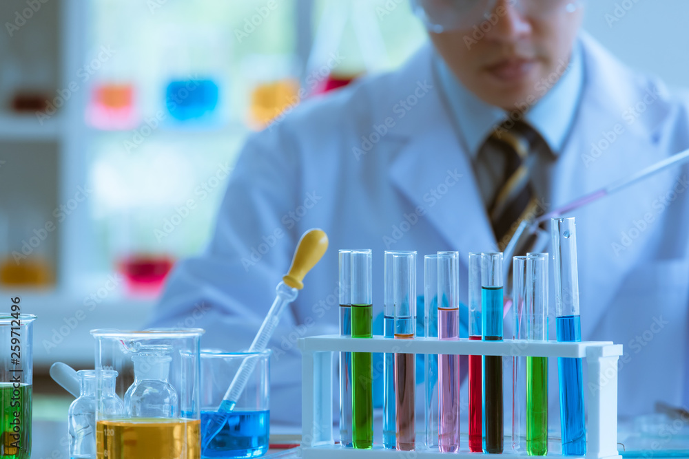 Male scientist collecting experimental samples. Male scientist collecting experimental samples.