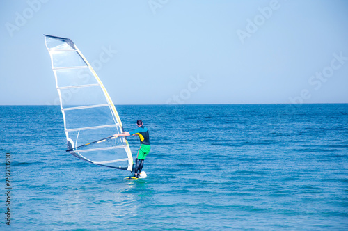 man windsurfing on the sea