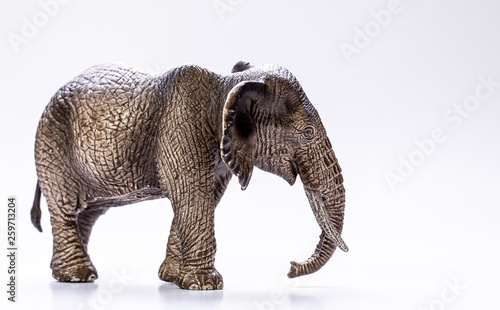 Side profile view of a model Elephant isolated on a white background