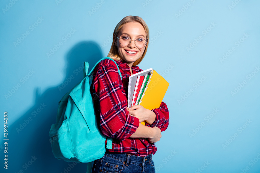 Portrait of her she nice charming cute attractive winsome girlish cheerful cheery teen girl wearing checked shirt holding in hands copy-book isolated on teal turquoise bright vivid shine background Portrait of her she nice charming cute attractive winsome girlish cheerful cheery teen girl wearing checked shirt holding in hands copy-book isolated on teal turquoise bright vivid shine background