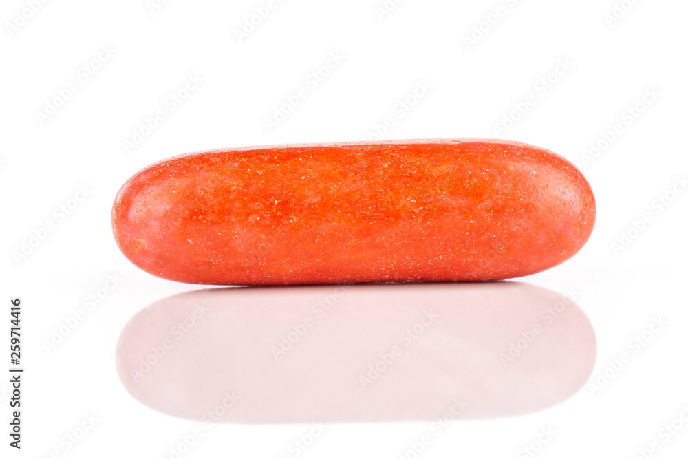 One whole red sweet licorice comfit isolated on white background One whole red sweet licorice comfit isolated on white background