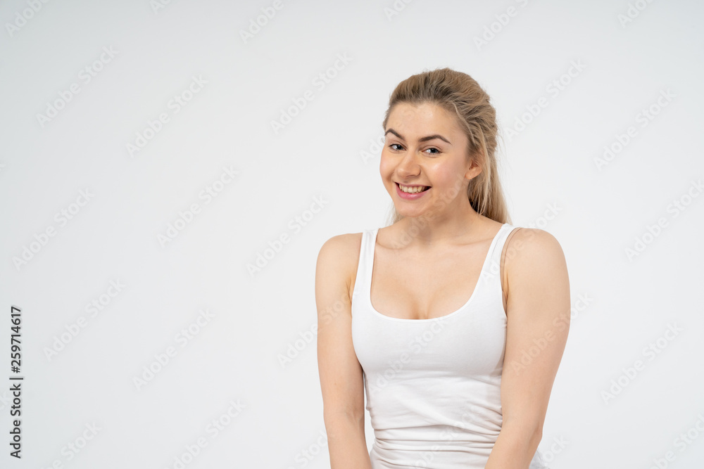 Young attractive girl is very happy, smiling and looking at the camera. Isolated on white background Young attractive girl is very happy, smiling and looking at the camera. Isolated on white background