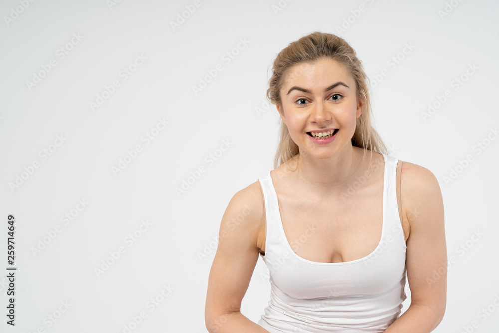 Young attractive girl is very happy, smiling and looking at the camera. Isolated on white background Young attractive girl is very happy, smiling and looking at the camera. Isolated on white background
