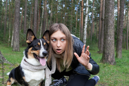 Принти на полотні Young woman showing on something Welsh Corgi Cardigan