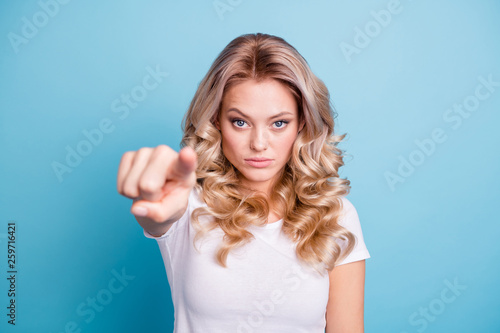 Close up photo beautiful her she lady hand arm index finger point you restriction stop stand there don't move warn attention wear casual white t-shirt clothes outfit isolated blue bright background