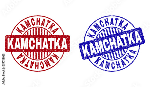 Grunge KAMCHATKA round stamp seals isolated on a white background. Round seals with grunge texture in red and blue colors. Vector rubber imitation of KAMCHATKA caption inside circle form with stripes.