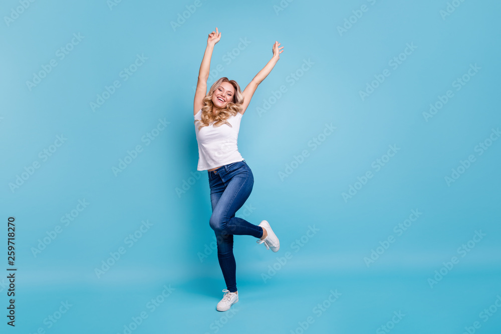 Full length body size view portrait of her she nice-looking lovely attractive cheerful cheery wavy-haired lady in casual white t-shirt having fun isolated over blue pastel background
