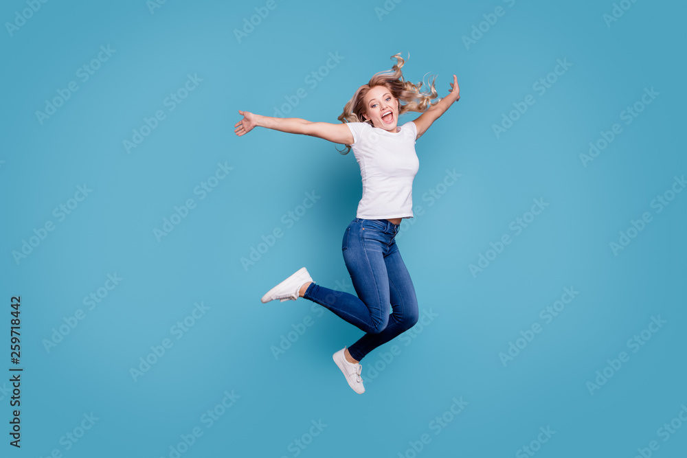 Full length body size view portrait of nice lovely attractive cheerful cheery optimistic dreamy wavy-haired lady in casual white t-shirt having fun day isolated over blue background