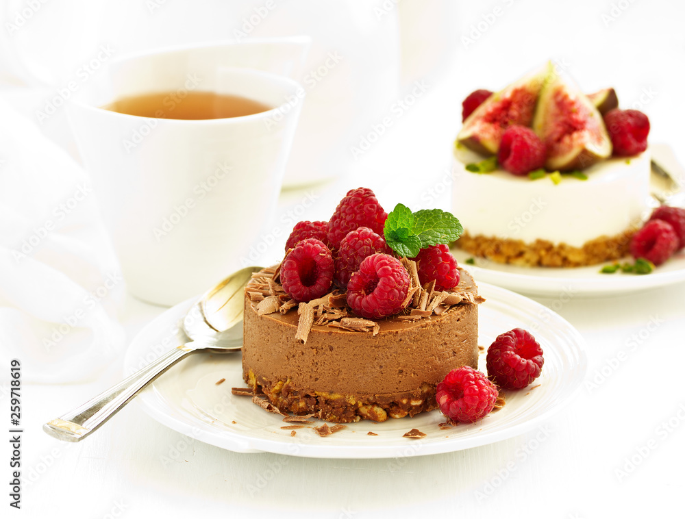 Delicious New York Chocolate Cheesecake with Raspberries. close-up. Delicious New York Chocolate Cheesecake with Raspberries. close-up.