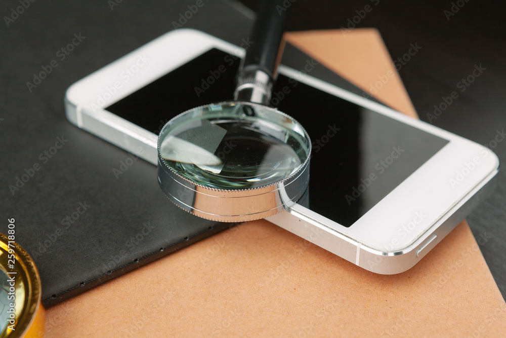Conceptual image depicting conducting an online search for information with a magnifying glass
