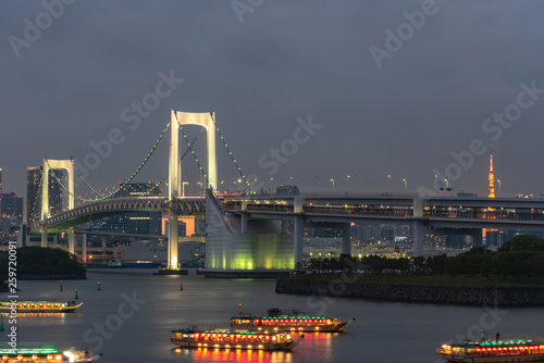 Beautiful night view of Odaiba, Tokyo Tower and Rainbow Bridge in Tokyo, Japan photo