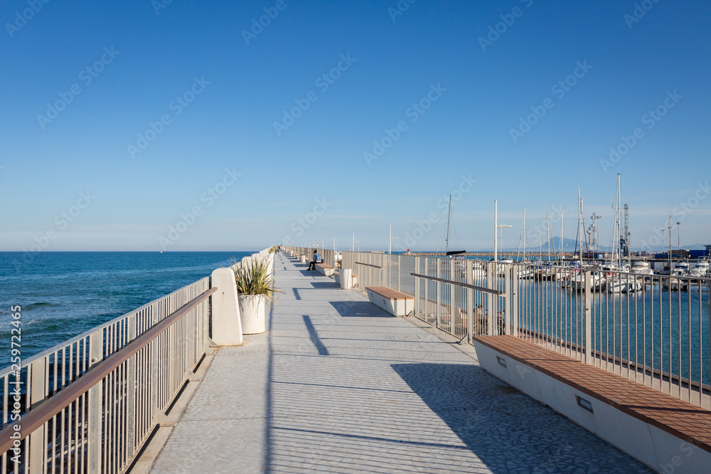 Empty footpath next to port of Gandia, Spain
