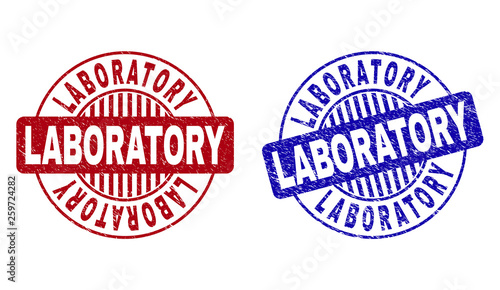 Grunge LABORATORY round stamp seals isolated on a white background. Round seals with grunge texture in red and blue colors. Vector rubber imprint of LABORATORY text inside circle form with stripes.