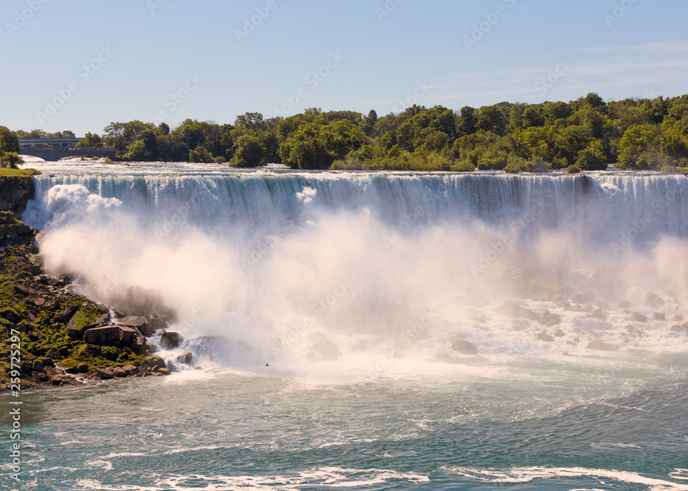 Beautiful view of turbulent Niagara waterfall in summer Beautiful view of turbulent Niagara waterfall in summer