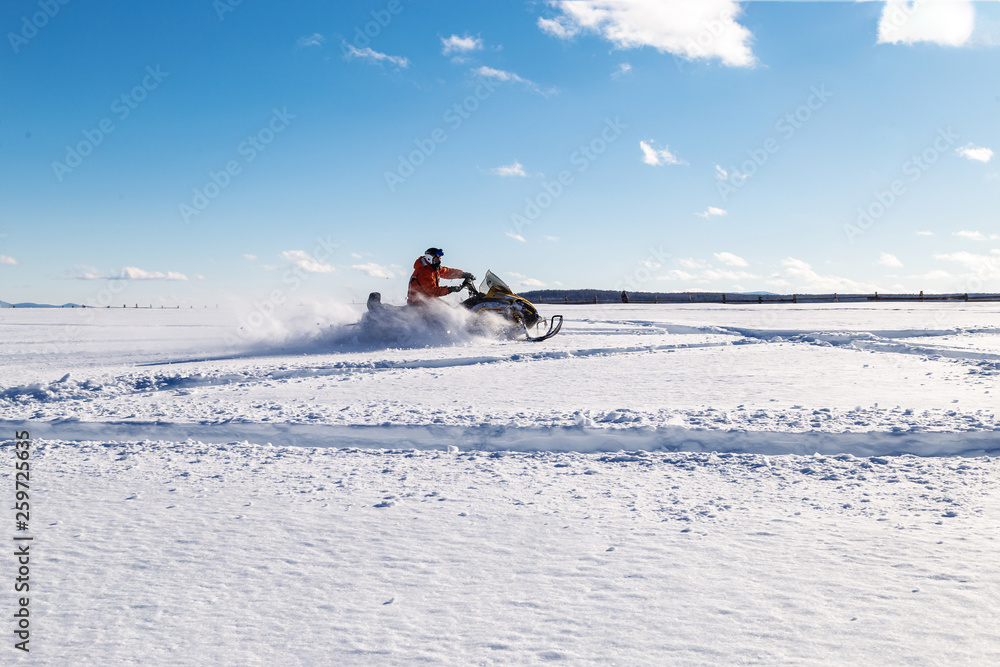 Athlete on a snowmobile. Athlete on a snowmobile.