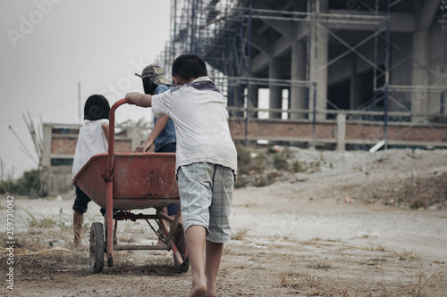 Child labor in building commercial building structures. World Labor Day concept