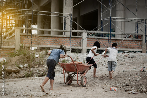 Child labor in building commercial building structures. World Labor Day concept