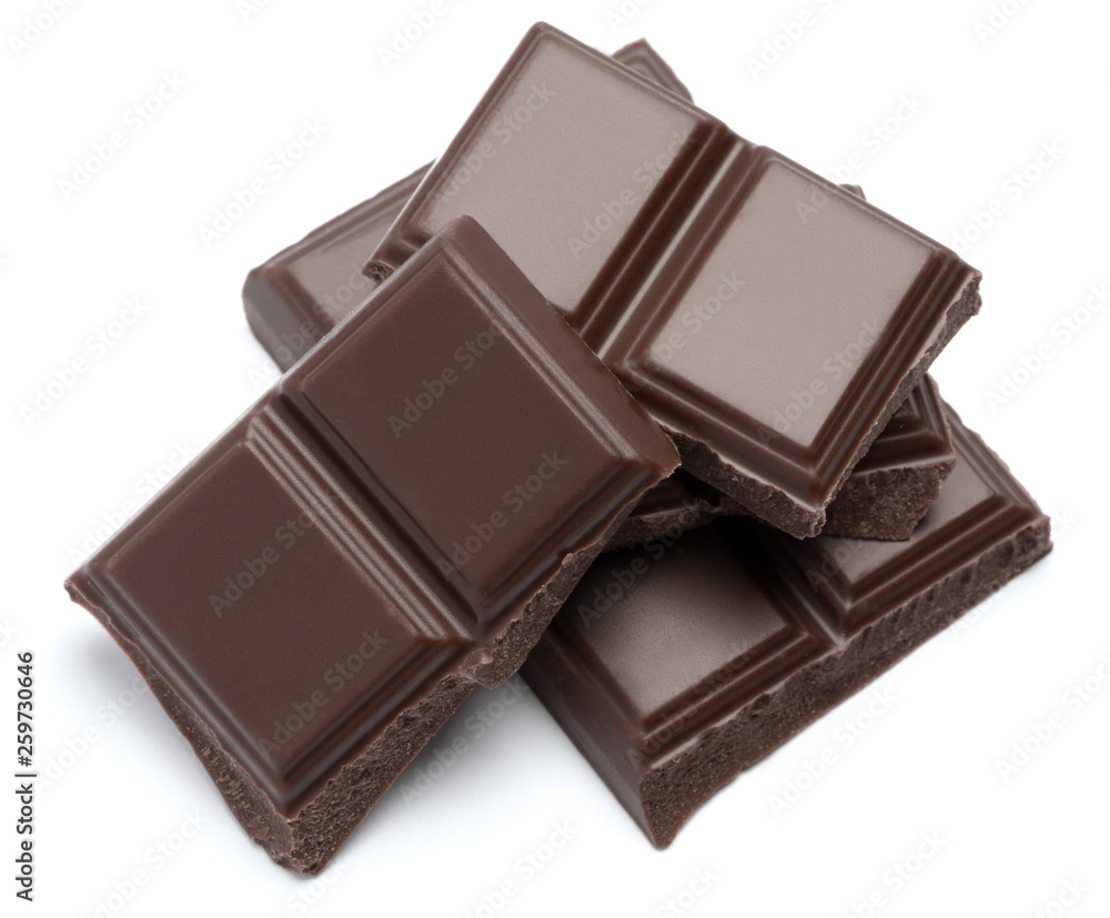 Milk organic chocolate pieces isolated on white background Milk organic chocolate pieces isolated on white background