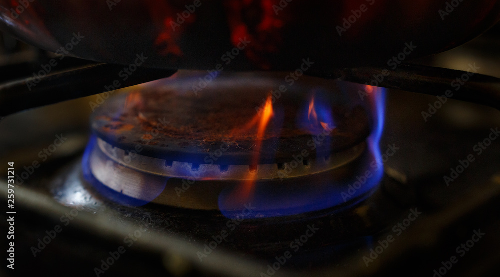old smoked kettle on a gas stove old smoked kettle on a gas stove