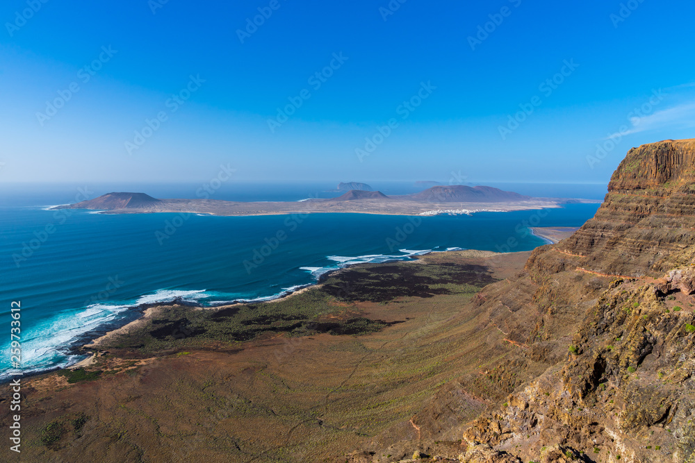 Spain, Lanzarote, Famara massif cliffs viewpoint with wide view to coast and la graciosa islet