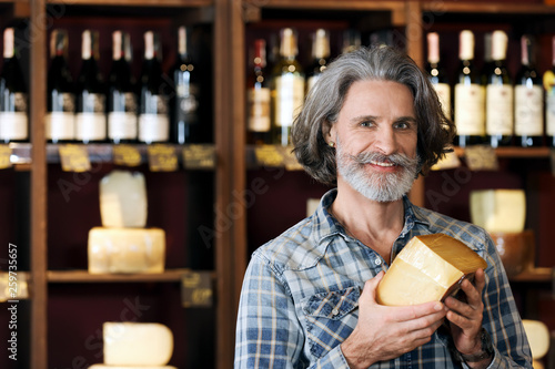 Business owner with cheese ...
