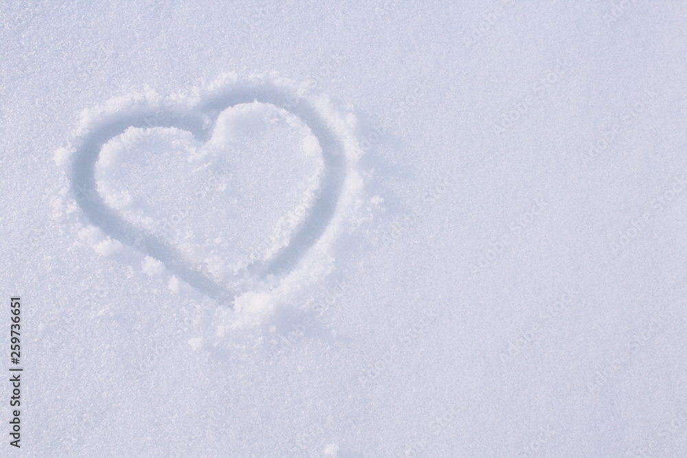 Heart drawn in the snow. Background. Texture.