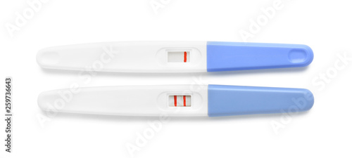 Negative and positive pregnancy tests on white background