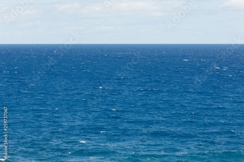 blue Atlantic Ocean background at sunny day