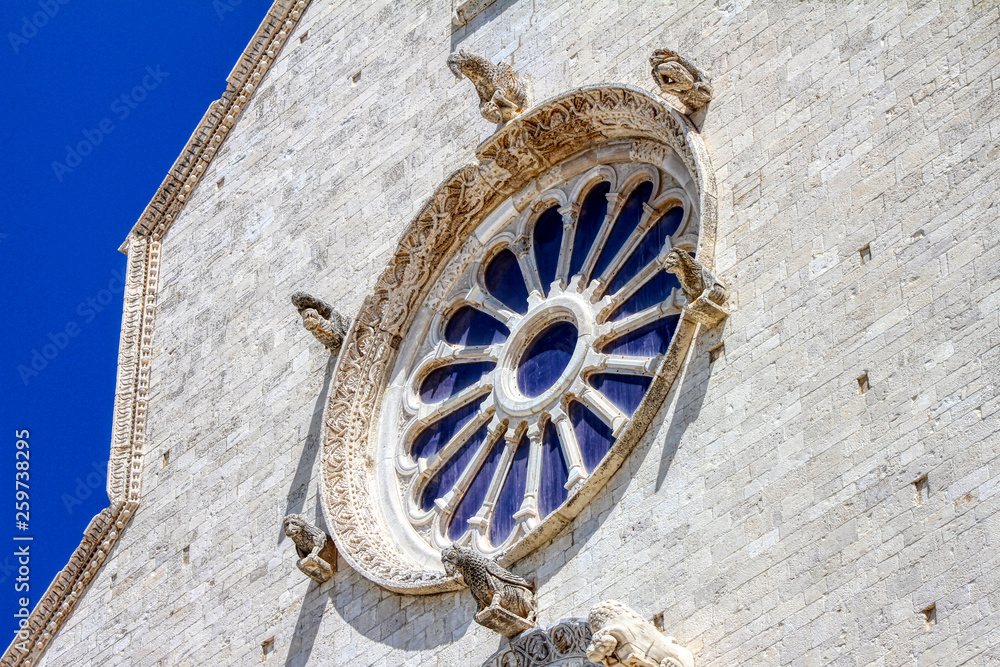 Rose window of the facade of the Roman Catholic cathedral dedicated to Saint Nicholas the Pilgrim in Trani, Puglia, Italy