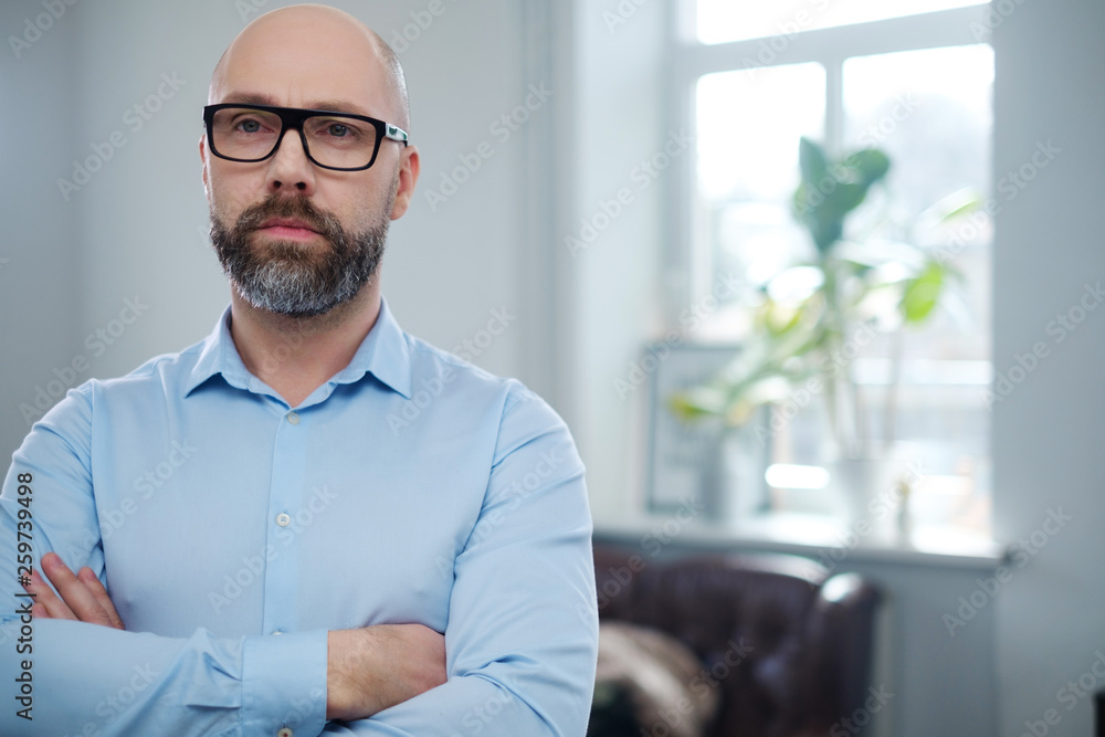 Fototapeta premium Bearded middle-aged man wearing glasses.