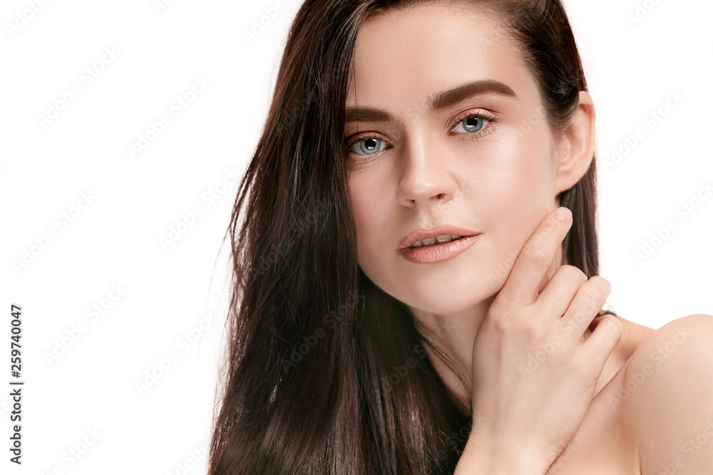 A beautiful female face. Perfect and clean skin of young caucasian woman on white studio background. A beautiful female face. Perfect and clean skin of young caucasian woman on white studio background.