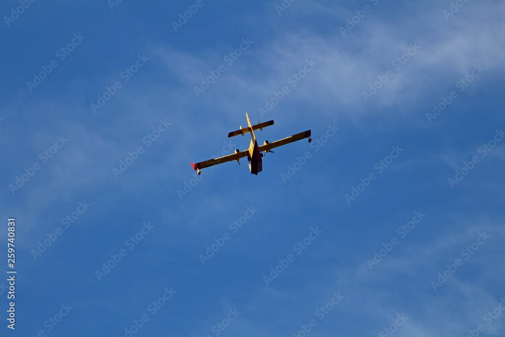 a canadair fire brigade plane seen from behind a canadair fire brigade plane seen from behind