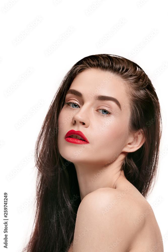 A beautiful female face. Perfect and clean skin of young caucasian woman on white studio background. A beautiful female face. Perfect and clean skin of young caucasian woman on white studio background.
